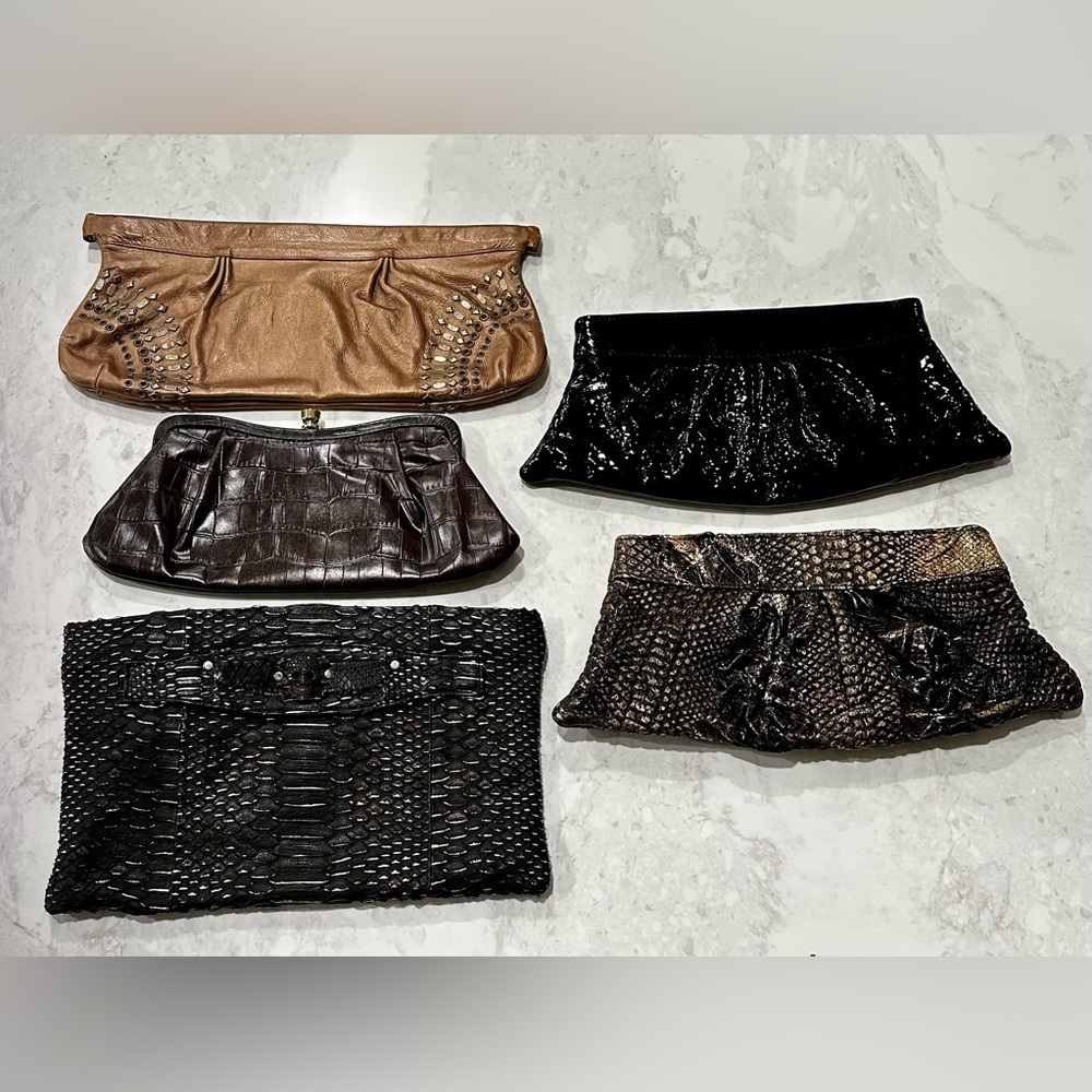 5  genuine chic leather clutch purses for sale. Each in excellent condition.